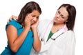 Unhappy Hispanic Girl and Concerned Female Doctor Royalty Free Stock Photo