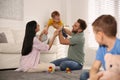 Unhappy little boy feeling jealous while parents spending time with his baby brother Royalty Free Stock Photo