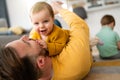 Unhappy little boy feeling jealous while perent spending time with his baby sister at home Royalty Free Stock Photo