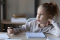 Unhappy small girl feel unmotivated studying at home Royalty Free Stock Photo