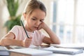 Unhappy little girl feel distressed studying at home Royalty Free Stock Photo