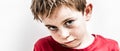 Unhappy little kid expressing bullied disillusion, fragile loneliness and fear Royalty Free Stock Photo