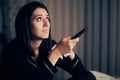 Sad Woman Crying Watching TV Holding a Remote Control Royalty Free Stock Photo