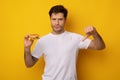 Unhappy Man Holding Burger Showing Thumbs Down Royalty Free Stock Photo