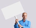 Unhappy man holds a placard Royalty Free Stock Photo