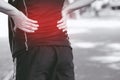 Unhappy man suffering from Sport injury while exercise, with Lower back pain in the spine with back ache. people health care or me