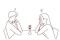 Unhappy man and woman at table in cafe