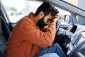 Unhappy Middle Eastern Driver Resting Head On Wheel In Car Royalty Free Stock Photo