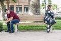 Unhappy Mixed Race Couple Sitting Facing Away From Each Other on Park Bench Royalty Free Stock Photo
