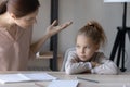 Unhappy mom scold lazy unmotivated daughter studying