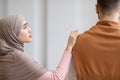 Unhappy Muslim Wife Touching Husband While He Ignoring Her Indoor