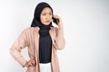 unhappy muslim woman in hijab making a call using a cell phone Royalty Free Stock Photo