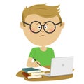 Unhappy nerd boy pupil with glasses sitting at the desk with stack of books and loptop