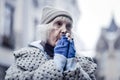 Unhappy poor aged woman feeling very cold Royalty Free Stock Photo