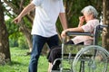 Unhappy,problems asian family,angry man or male caregiver expelled his elderly woman in wheelchair quarrel,arguing,senior mother Royalty Free Stock Photo