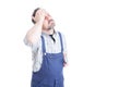 Unhappy repairman with closed eyes touching his forehead