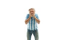 The unhappy and sad Argentinean fan on white background Royalty Free Stock Photo