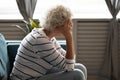 Unhappy sad mature woman covering face with hands, feeling lonely Royalty Free Stock Photo