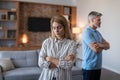 Unhappy sad middle aged european husband ignores offended wife after scandal and think about divorce Royalty Free Stock Photo