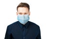 Unhappy, sad young man wearing a protective face mask prevent virus infection or pollution on white isolated background Royalty Free Stock Photo