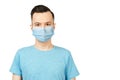 Unhappy, sad young man wearing a protective face mask prevent virus infection or pollution on white isolated background Royalty Free Stock Photo