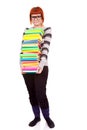 Unhappy school girl with stack color books