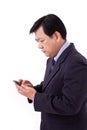 Unhappy senior businessman receiving bad news via smartphone app Royalty Free Stock Photo