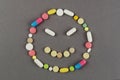 Unhappy smile created from colored pills. Medical concept Royalty Free Stock Photo