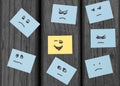 Unhappy smilies and a happy face painted on office stickers