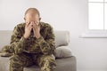 Unhappy soldier in uniform feel stressed and pensive