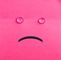 Unhappy sticky note. Pink paper Royalty Free Stock Photo