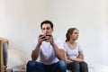 Unhappy & stressed young married couple. Angry offended sullen marriage with depression and disappointtd after argument. Conflict Royalty Free Stock Photo