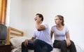 Unhappy & stressed young married couple. Angry offended sullen marriage with depression and disappointtd after argument. Conflict Royalty Free Stock Photo