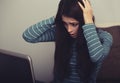 Unhappy surprising woman with headache sitting near the laptop. Closeup portrait of business person on work Royalty Free Stock Photo