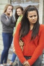 Unhappy Teenage Girl Being Gossiped About By Peers Royalty Free Stock Photo