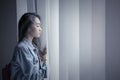 Unhappy teenage girl looking out the window Royalty Free Stock Photo