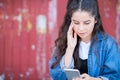 Teenage Girl Victim Of Bullying By Text Message Outdoors Royalty Free Stock Photo