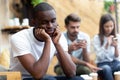 Lonely black male outcast feel sad lack communication Royalty Free Stock Photo