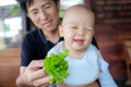 Unhappy toddler doesn`t want eat healthy vegetables Royalty Free Stock Photo