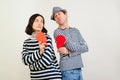 Unhappy valentine day. Young couple holding broken heart. Family quarrels and conflicts Royalty Free Stock Photo