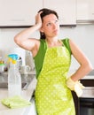 Unhappy woman cleaning furniture Royalty Free Stock Photo