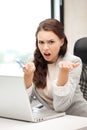 Unhappy woman with computer and euro cash money Royalty Free Stock Photo