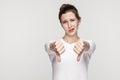 Unhappy woman demonstrate dislike sign Royalty Free Stock Photo