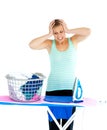 Unhappy woman ironing her clothes Royalty Free Stock Photo