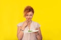 Unhappy woman with a plate of green salad Royalty Free Stock Photo