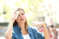 Unhappy woman sweating suffering a heat stroke Royalty Free Stock Photo