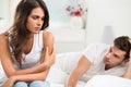 Unhappy young couple in bedroom Royalty Free Stock Photo