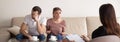 Unhappy young couple consulting family psychologist, arguing, ho