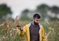 Farmer showing corn cob with disease Royalty Free Stock Photo