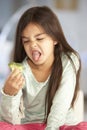 Unhappy Young Girl Rejecting Plate Of Fresh Vegetables